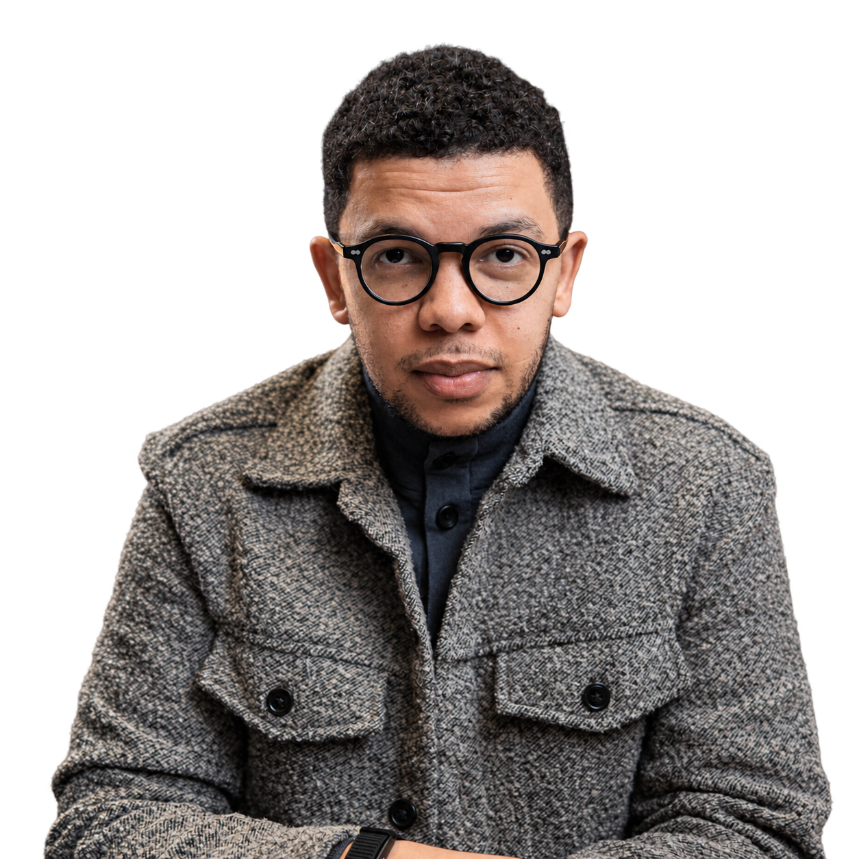 Portrait of Sizwe Mpofu-Walsh wearing a grey jacket.